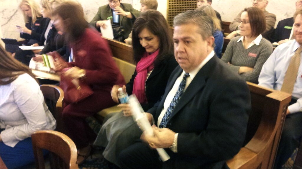 Superintendent Tom Luna sits with his wife before he gives is education budget request to lawmakers. 