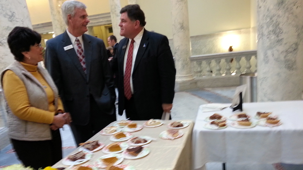 Sen. President Pro Tem Brent Hill, center, and Rep. Jeff Thompson, right, wait for a slice of pie on Wednesday.