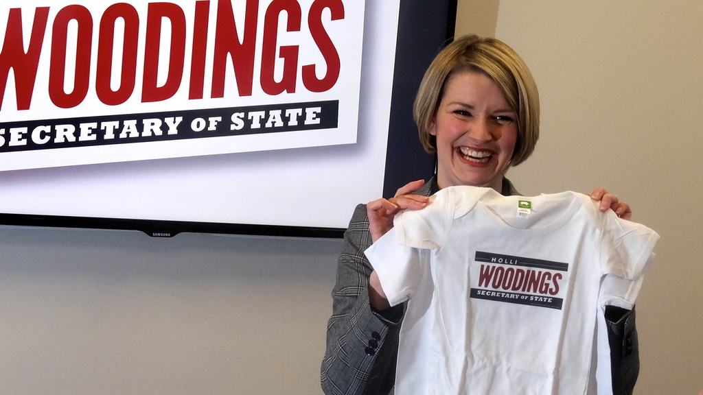 Boise Democrat Holli Woodings holds up a campaign shirt made especially for her 3-year-old daughter, Mary. On Friday, Woodings announced her candidacy for Idaho secretary of state. 