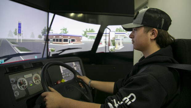 Nathan Cooper, 16, a student at Middleton High School drives a simulated semi-truck through stormy conditions on Wednesday, Jan. 26, 2022. Photo taken by Kyle Pfannenstiel of Idaho EdNews.