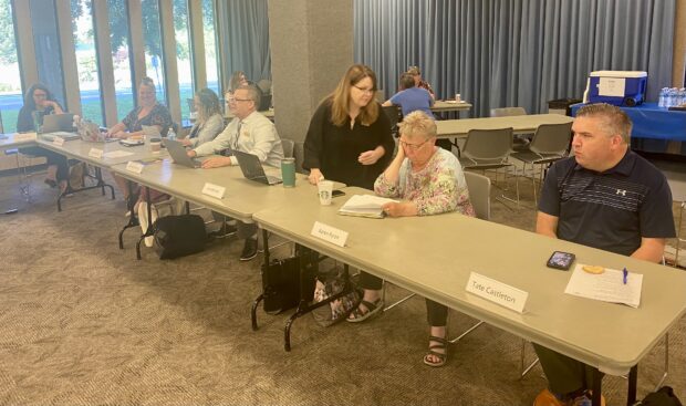 Idaho Professional Standards Commission board members prepare for a busy second day of meetings.