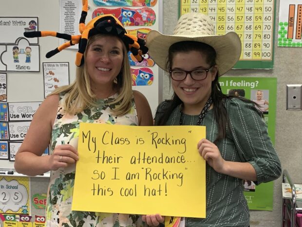 Teachers at Wilson Elementary rocking their cool hats because their students rocked their attendance.