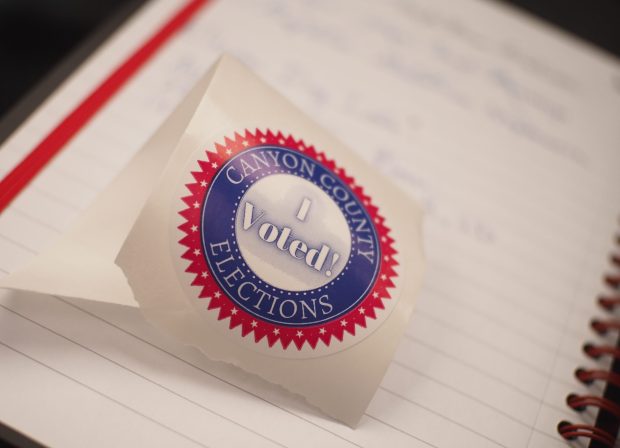 A red, white and blue sticker given to voters proclaiming "I Voted!" encircled by the words "Canyon County Elections."