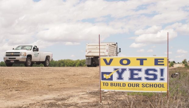 On Emmett Road, a sign urges Middleton residents to "Vote YES! to build our school."
