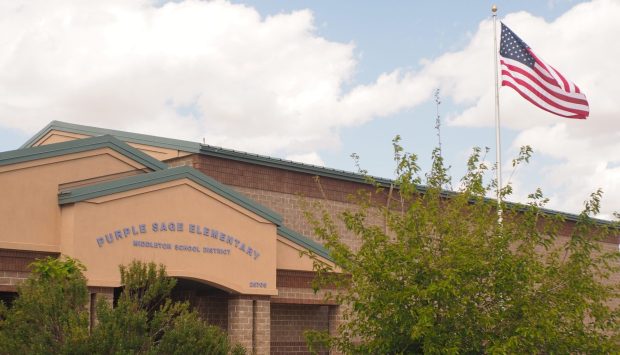 Old Glory flies at full mast before the entrance of Purple Sage Elementary in Middleton, ID.