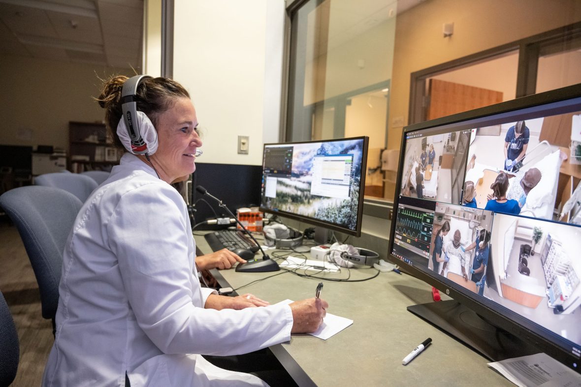 Amy Spurlock, an endowed chair and professor in Boise State University’s School of Nursing, works with students in the Simulation Center. (Priscilla Grover/Boise State University)