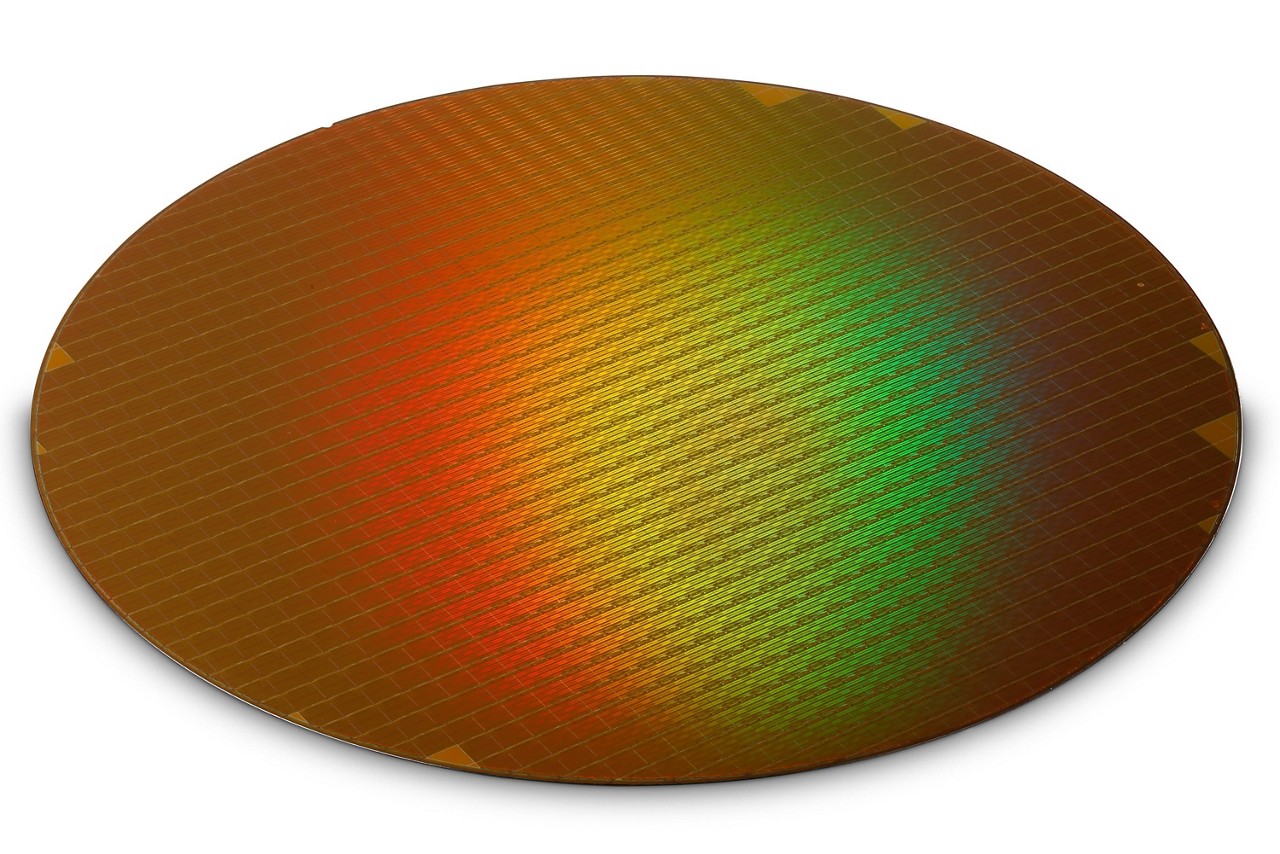 wafer A silicon wafer in the early stage of becoming a batch of semiconductors. (Micron photo)