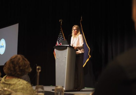 Debbie Critchfield at IASA conference presenting award